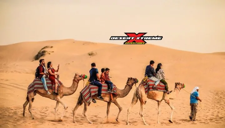 Family enjoying camel ride during family-friendly desert safari Dubai in UAE desert
