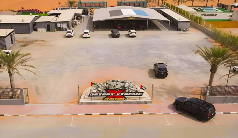 Desert Xtreme Adventures Dubai desert safari camp aerial view with dune buggy, quad bike rides and luxury desert experience