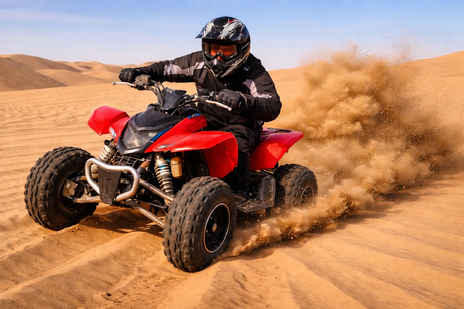 Morning desert safari in Dubai with quad biking adventure on red ATV riding over sand dunes at sunrise